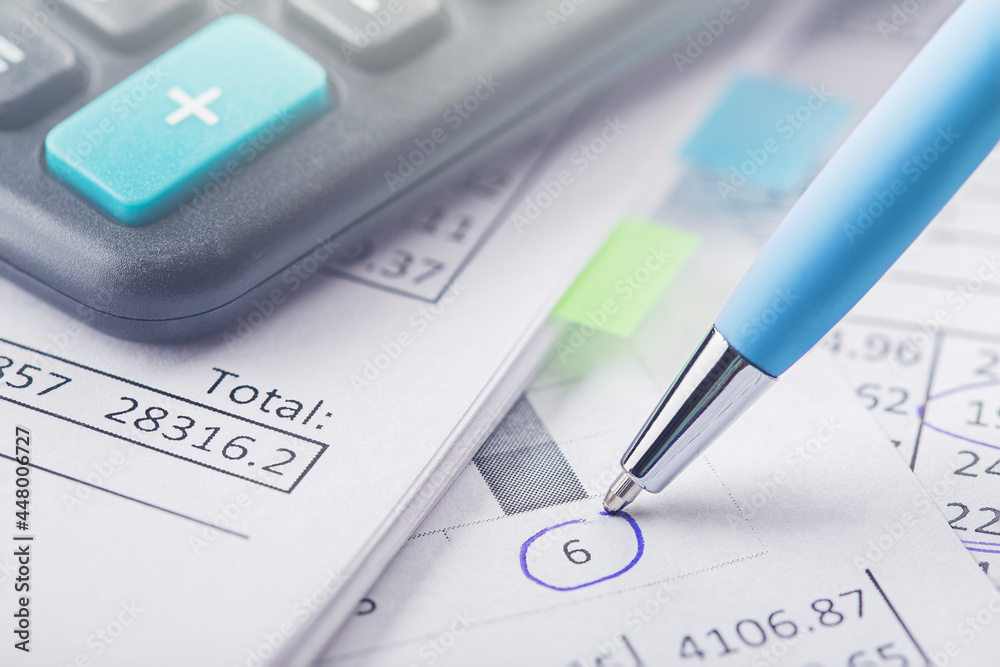 accounting document with pen and calculator. Concept of banking, financial report and financial audit. accounting document with pen and calculator. Concept of banking, financial report and financial audit.