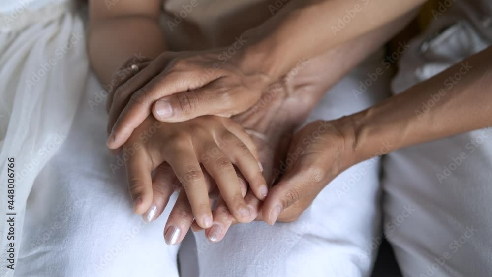 close-up of female hands of three generations of women close-up of female hands of three generations of women