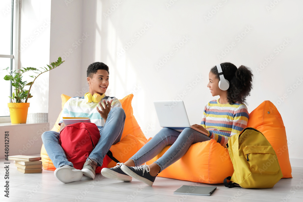 African-American brother and sister studying at home African-American brother and sister studying at home