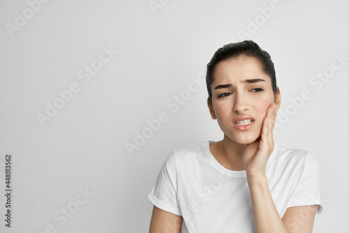 woman with aching tooth health problems dissatisfaction isolated background