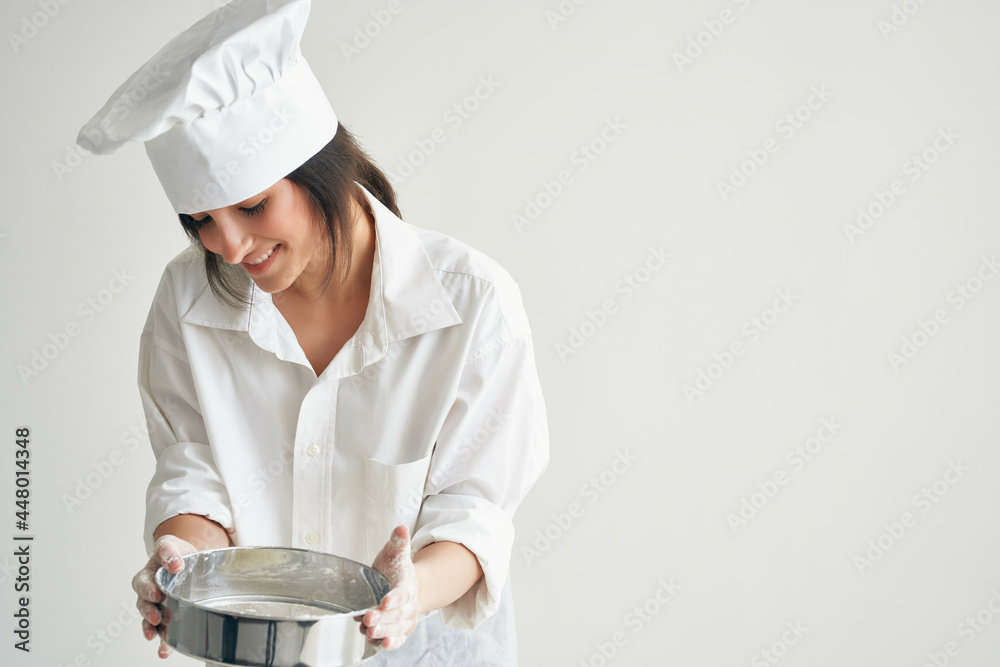 woman chef's uniform kneading dough working with flour Professional woman chef's uniform kneading dough working with flour Professional