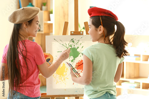 Cute Asian sisters drawing ...