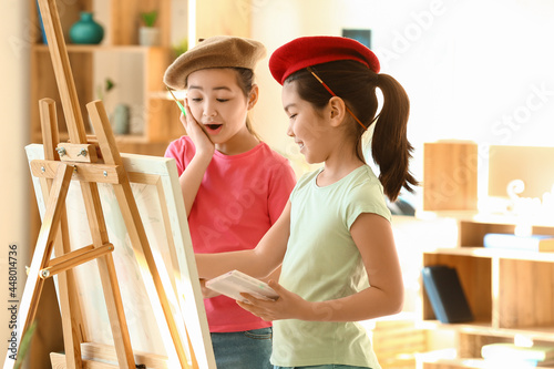 Cute Asian sisters drawing ...