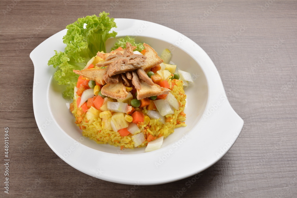 vegetarian nasi goreng fried rice with pineapple, vegetables meat in spicy chilli sambal sauce on wood background asian halal vegan menu vegetarian nasi goreng fried rice with pineapple, vegetables meat in spicy chilli sambal sauce on wood background asian halal vegan menu