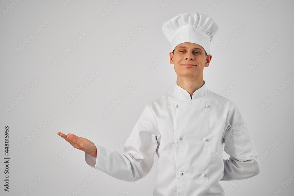 Cheerful male chef gesturing with his hands kitchen restaurant professional Cheerful male chef gesturing with his hands kitchen restaurant professional