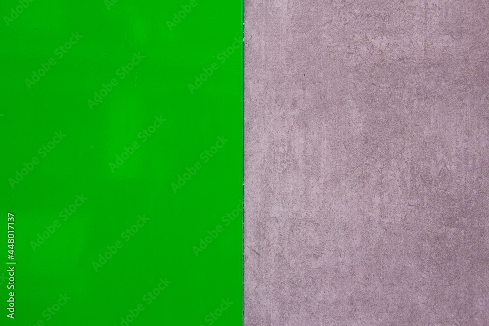 Fototapeta premium Polished green texture with gray wall texture. Space for text. Background. Modern design.