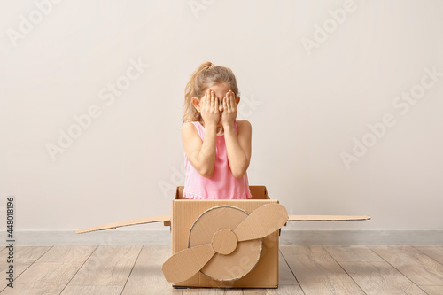 Little girl playing with ca...
