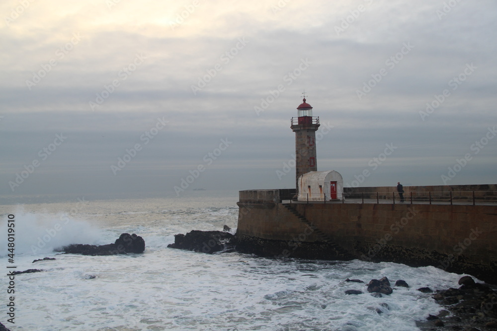 lighthouse on the shore of the sea