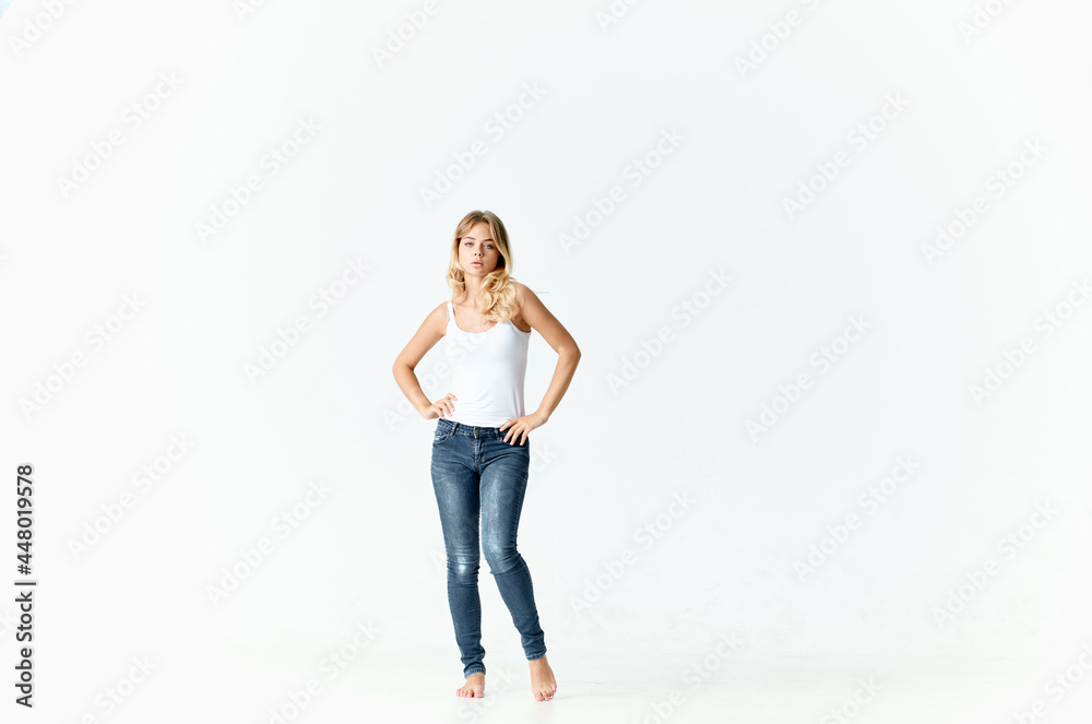woman in white t-shirt and jeans design isolated background woman in white t-shirt and jeans design isolated background