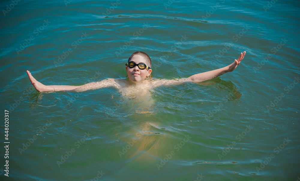 13 years Teenage boy swimming in lake, Children lifestyle. Enjoy the life 13 years Teenage boy swimming in lake, Children lifestyle. Enjoy the life