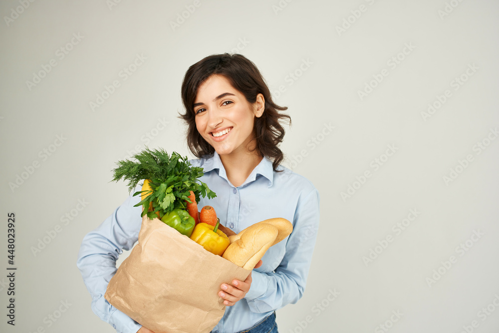 woman with a package of groceries healthy food vegetables supermarket shopping woman with a package of groceries healthy food vegetables supermarket shopping