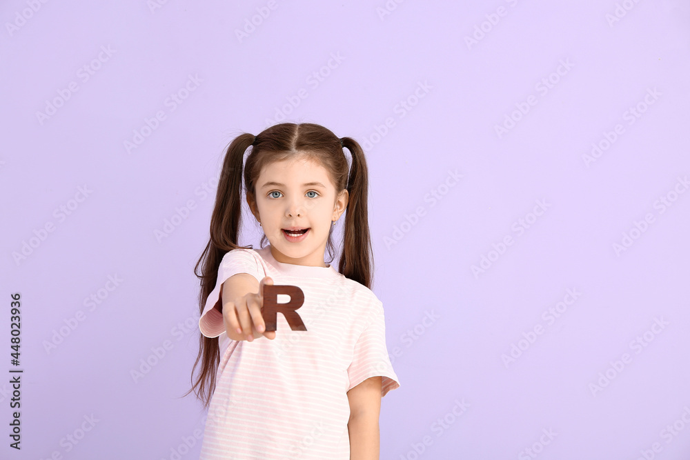 Little girl with letter R on color background Little girl with letter R on color background
