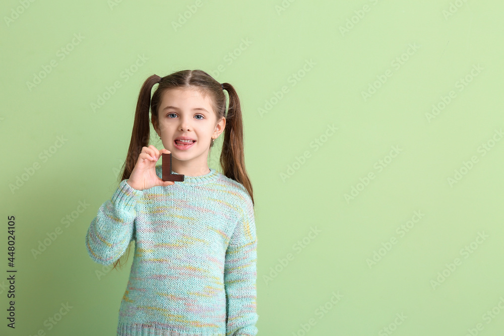 Little girl with letter L on color background Little girl with letter L on color background