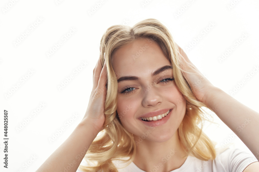 pretty blonde holding hair glamor cosmetics light background pretty blonde holding hair glamor cosmetics light background