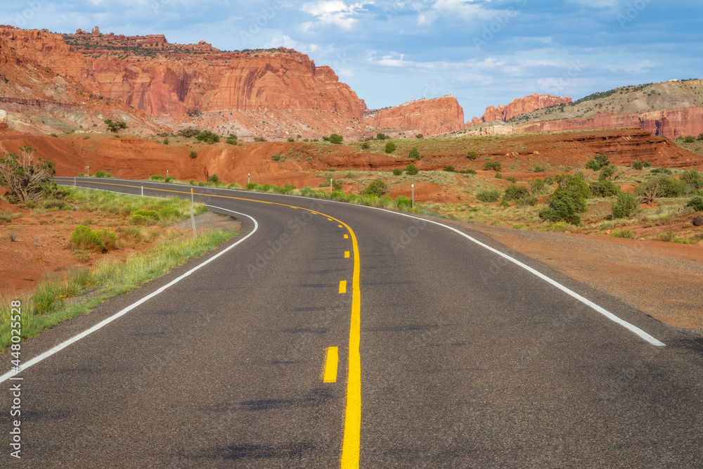 The highway curves through Capitol Reef National Park, Utah