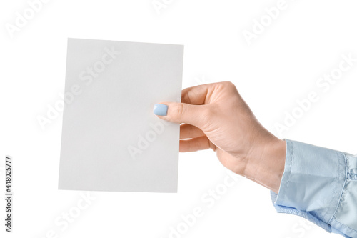 Woman holding blank sheet of paper on white background © Pixel-Shot
