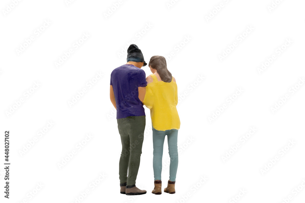 Miniature people couple in casual cloth standing together isolated on white background with clipping path. Miniature people couple in casual cloth standing together isolated on white background with clipping path.