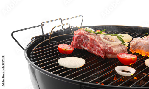 Barbecue grill with raw meat and vegetables on white background