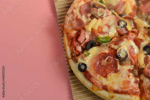 Super Supreme Mozzarella Cheese Pizza isolated on pink background