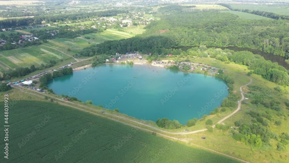The flooded quarry is a resting place and a beach. Beach on a flooded quarry. An artificial beach in a flooded quarry. The flooded quarry is a resting place and a beach. Beach on a flooded quarry. An artificial beach in a flooded quarry.