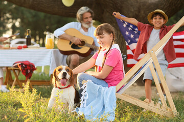 Happy family at barbecue party on summer day