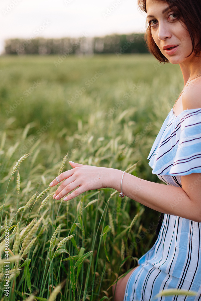 Beautiful young woman in summer in a wheat field Beautiful young woman in summer in a wheat field