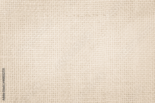 Jute hessian sackcloth canvas woven texture pattern background in light beige cream brown color blank empty