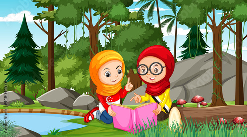 Muslim kids wears traditional clothes reading a book in the forest scene