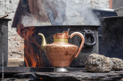 Принти на полотні Old brass jug and a large saucepan on the kitchen in a Tibetan monastery Hemis m