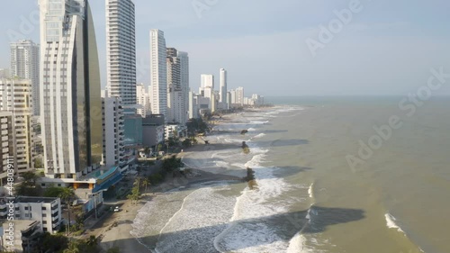 Aerial Orbiting Shot Along Cartagena Coastline on Hot Summer Day. Skyscrapers photo