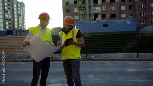 Workers talks to other about house project photo