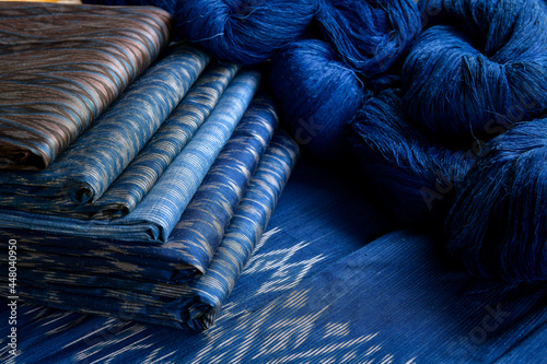 Crafts and craftsmanship. Traditional Isan Thai silk indigo weaving.Craftsmen of Thai Silk.