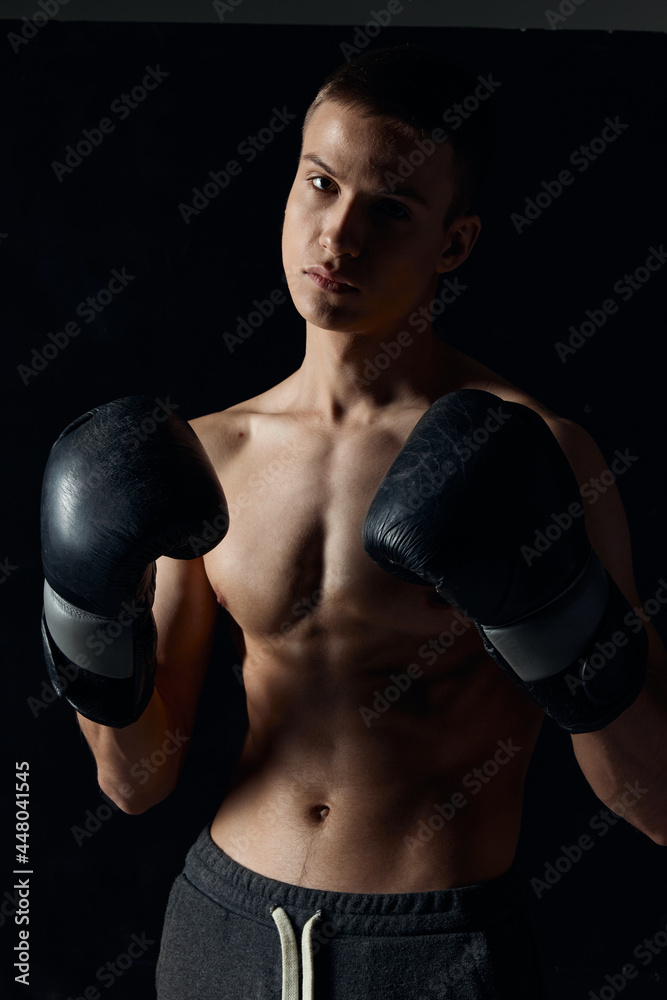 athlete boxing gloves on a black background nude torso boxing workout