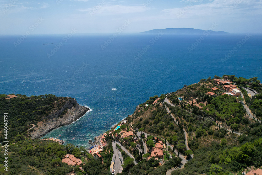 Cala Piccola, province of Grosseto, village and beach near Porto Santo Stefano photographed with drone. It offers one of the most beautiful coast in Toscana with cliffs and beaches. Italy 