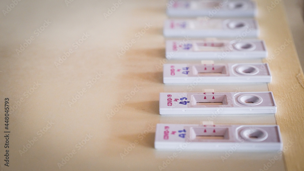 Covid-19 test kit Antigens, rapid detection placed on the table. Fast and large virus detection. Covid-19 test kit Antigens, rapid detection placed on the table. Fast and large virus detection.