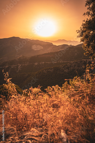 view of a natural landscape in the mountains at dawn