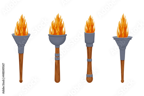 Set medieval torch with flame in cartoon style isolated on white background. Antique lamp, winer symbol. ui game asset.