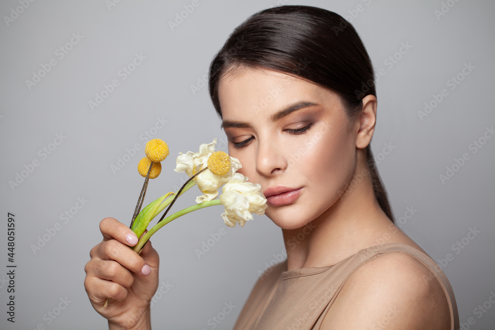 Healthy woman with clear skin and flowers portrait Healthy woman with clear skin and flowers portrait