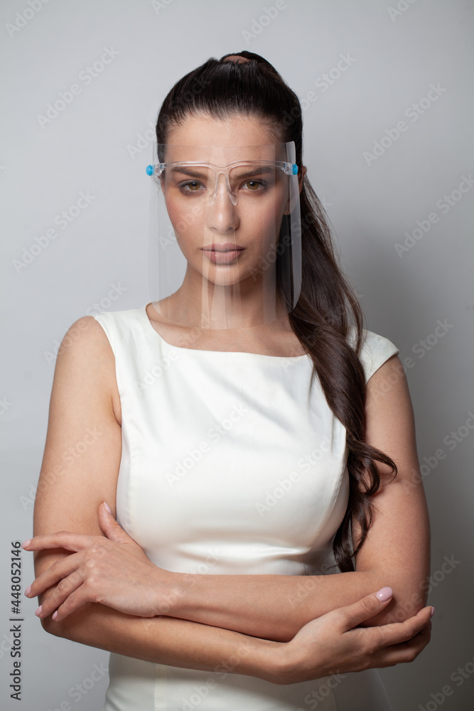 Fashion model woman brunette in face shields on white background Fashion model woman brunette in face shields on white background
