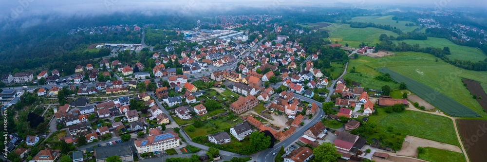 Aerial view of the village Behringersdorf beside the city Schwaig in Germany, Bavaria on a cloudy morning day in Spring