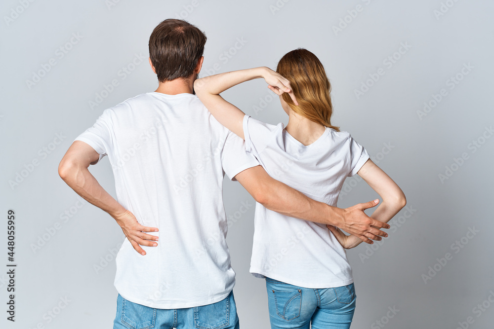 man and woman in white t-shirts stand with their backs design studio man and woman in white t-shirts stand with their backs design studio