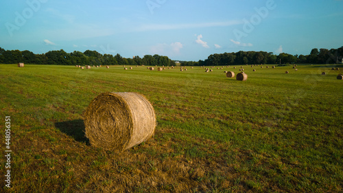 A bird s-eye view of a field with haystacks. High quality photo