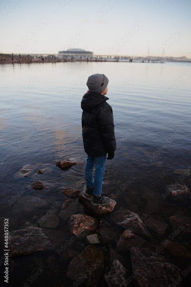 child on the lake