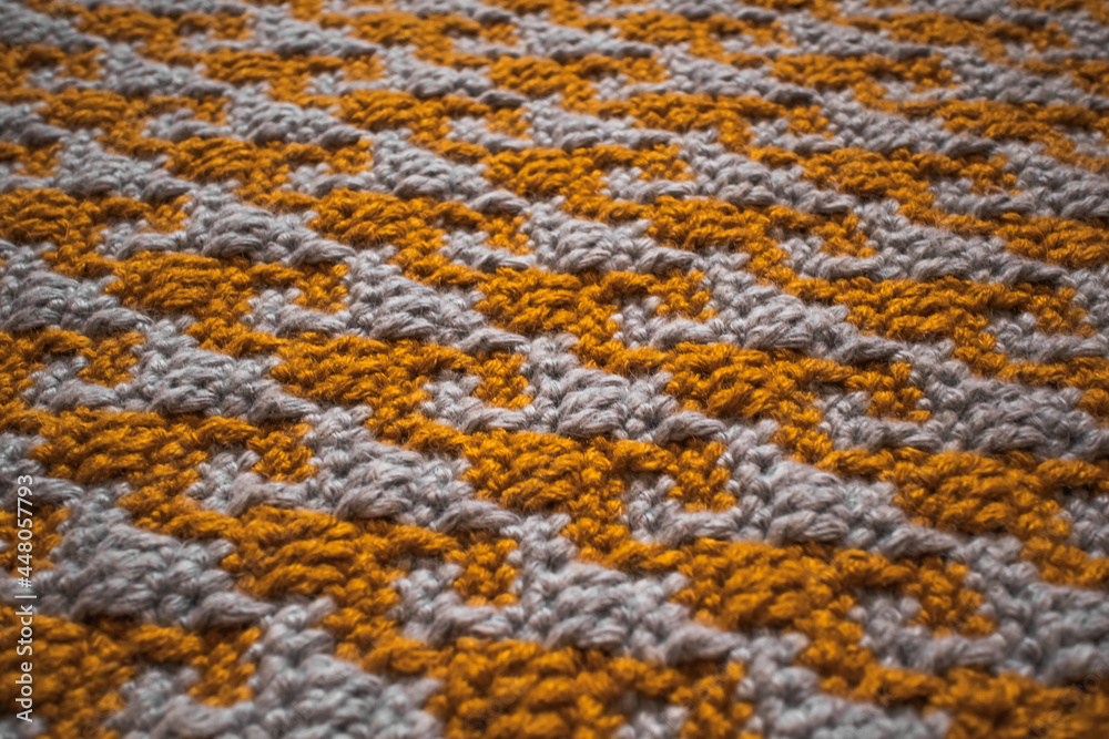 Fototapeta premium Bright tight crochet pattern. Domino pattern in the style of mosaic crochet.