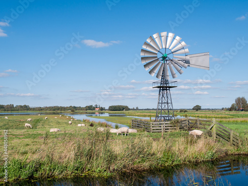 Windwatermill draining wetland polder, water level control in national park Alde Feanen, Friesland, Netherlands photo