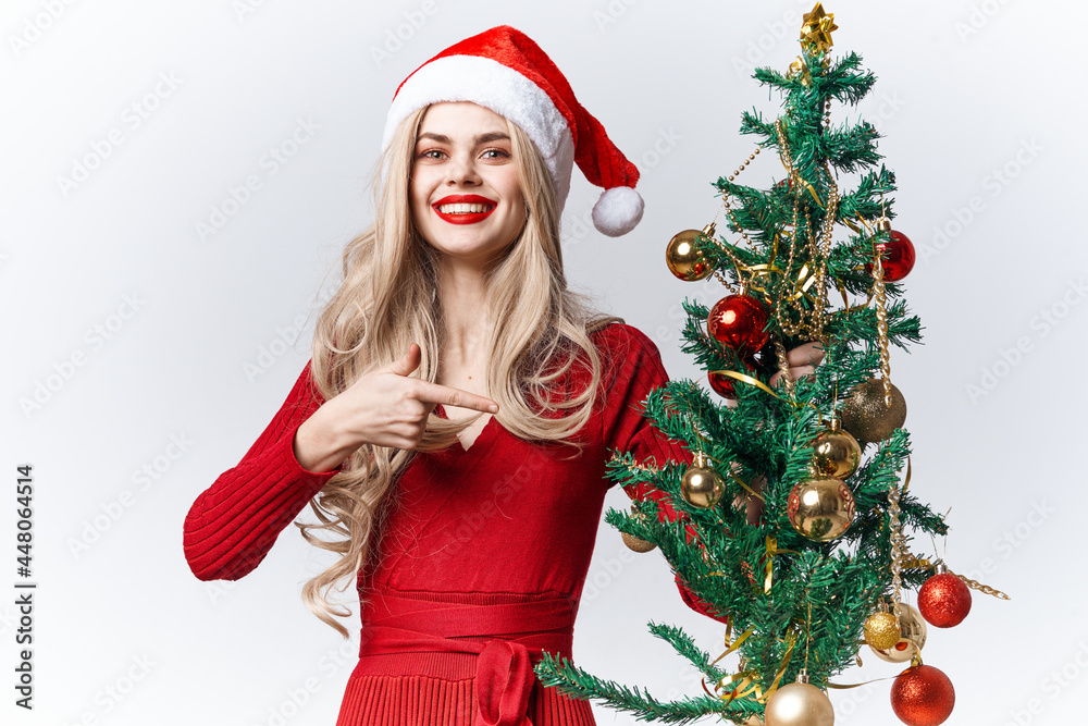 joyful woman decorates christmas tree tradition christmas holiday
