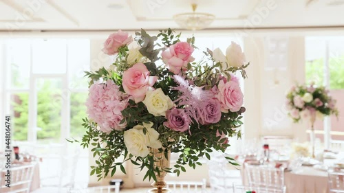 Wedding Decoration with Bouquets of Natural Fresh Flowers. Flowers at wedding decorated floral for wedding party reception. Event in restaurant.