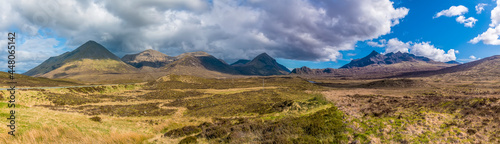 A panorama view across the unspoilt landscape of Isle of Skye towards the distant Cuillin Hills, Scotland on a summers day