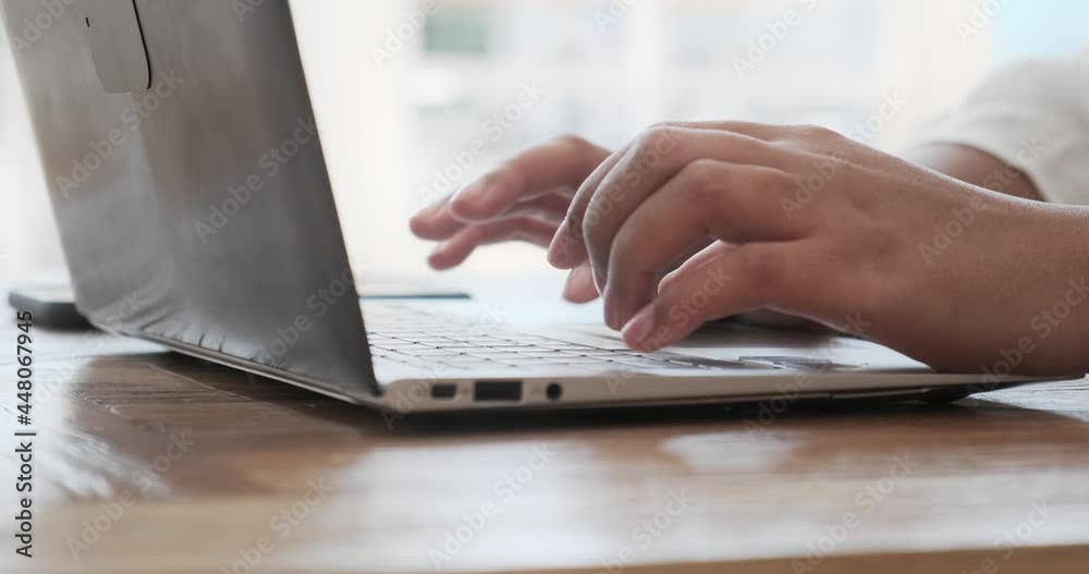 Young black woman working on laptop keyboard for send emails and surf on a web browser, businesswoman scrolling and web surfing online at work, student professional study, working from home or office