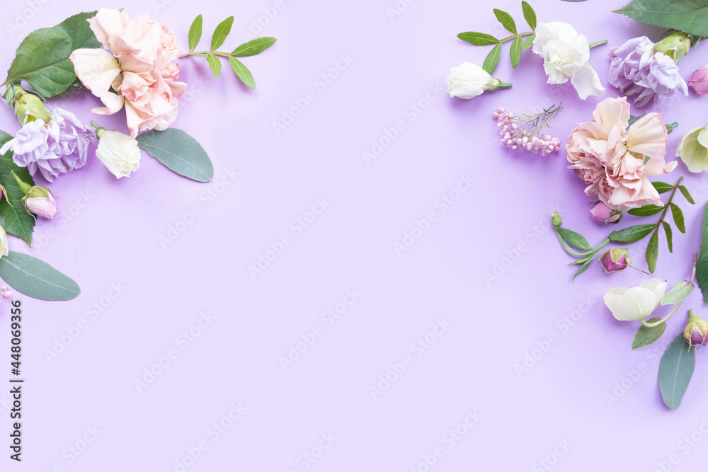 Floral frame with pink roses, white flowers, branches, leaves and petals on violet background. Flat lay, top view